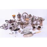 A collection of silver-plated wares to include spirit kettle, teapot, sugar caster, and other