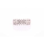 An 18ct white gold and diamond ring, the band set with three rows of round brilliant-cut diamonds,