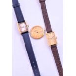 A yellow metal Tissot ladies watch, with rectangular case and baton dial, on a brown leather