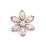 A Victorian diamond cluster brooch, in the form of a six-petal open flowerhead; each elliptical