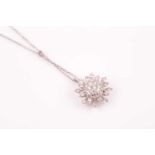 A diamond cluster pendant; the bombe centre pave set with round brilliant cut diamonds to an