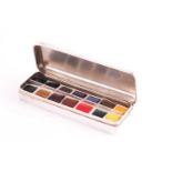 Tiffany & Co. An artist's silver travelling palette; rounded rectangular and fitted with fourteen