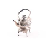 An Edwardian silver spirit kettle and stand. Sheffield 1907 by Walker & Hall. The kettle with half