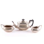 An early 20th century matched three-piece tea set. London 1908 and other dates by Walker & Hall Ltd.