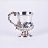 A late Georgian silver cup, embossed floral and foliate decoration to body, on circular spreading