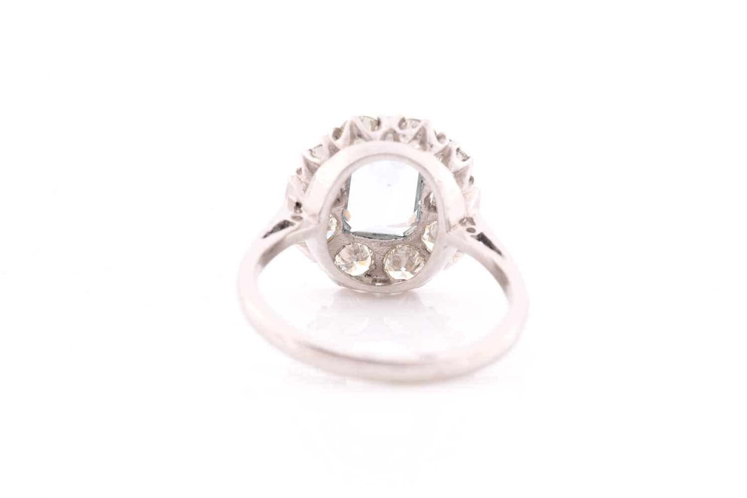 A platinum, diamond, and aquamarine ring, set with an emerald-cut aquamarine of approximately 1.20 - Image 2 of 3