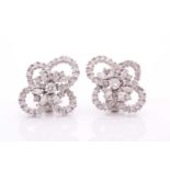 A pair of 18ct white gold and diamond quatrefoil cluster earrings, set with round and marquise-cut