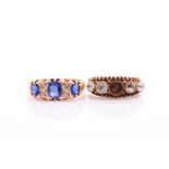 Two antique paste rings; one set with three sapphire-coloured glass stones, with diamond accents and