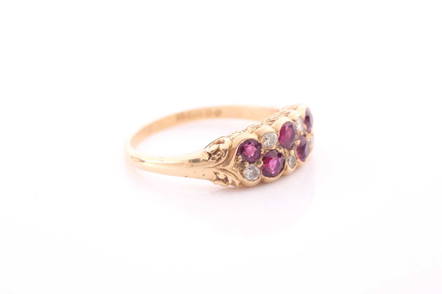 An 18ct yellow gold, diamond, and ruby ring, rubover set with mixed round-cut rubies and old-cut - Image 2 of 4