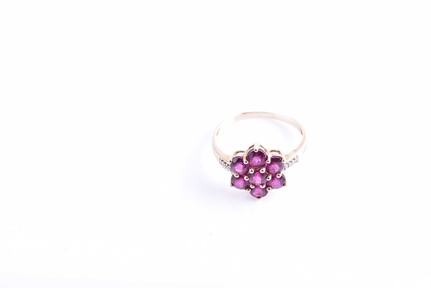 A 9ct yellow gold, diamond, and rhodalite garnet floral cluster ring set with seven round-cut - Image 2 of 4