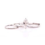 A platinum shaped wedding band ring, size R 1/2, together with a platinum round ring with beaded