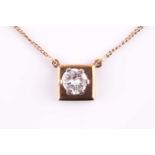 A single stone diamond pendant, the round brilliant-cut diamond set in a in six claw mount above a