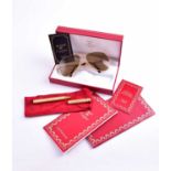 A Must de Cartier gilt metal pen, in original box, together with a pair of Cartier sunglasses, in