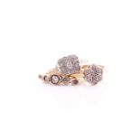 An Edwardian five stone half hoop diamond ring; the graduated old cut diamonds in collet mounts;