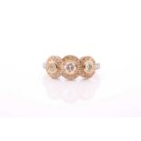 An 18ct yellow gold, platinum, and diamond ring, the yellow gold triple cluster mount inset with