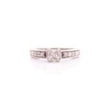 A single stone princess cut diamond ring; the princess cut diamond in four claw mount to seven stone