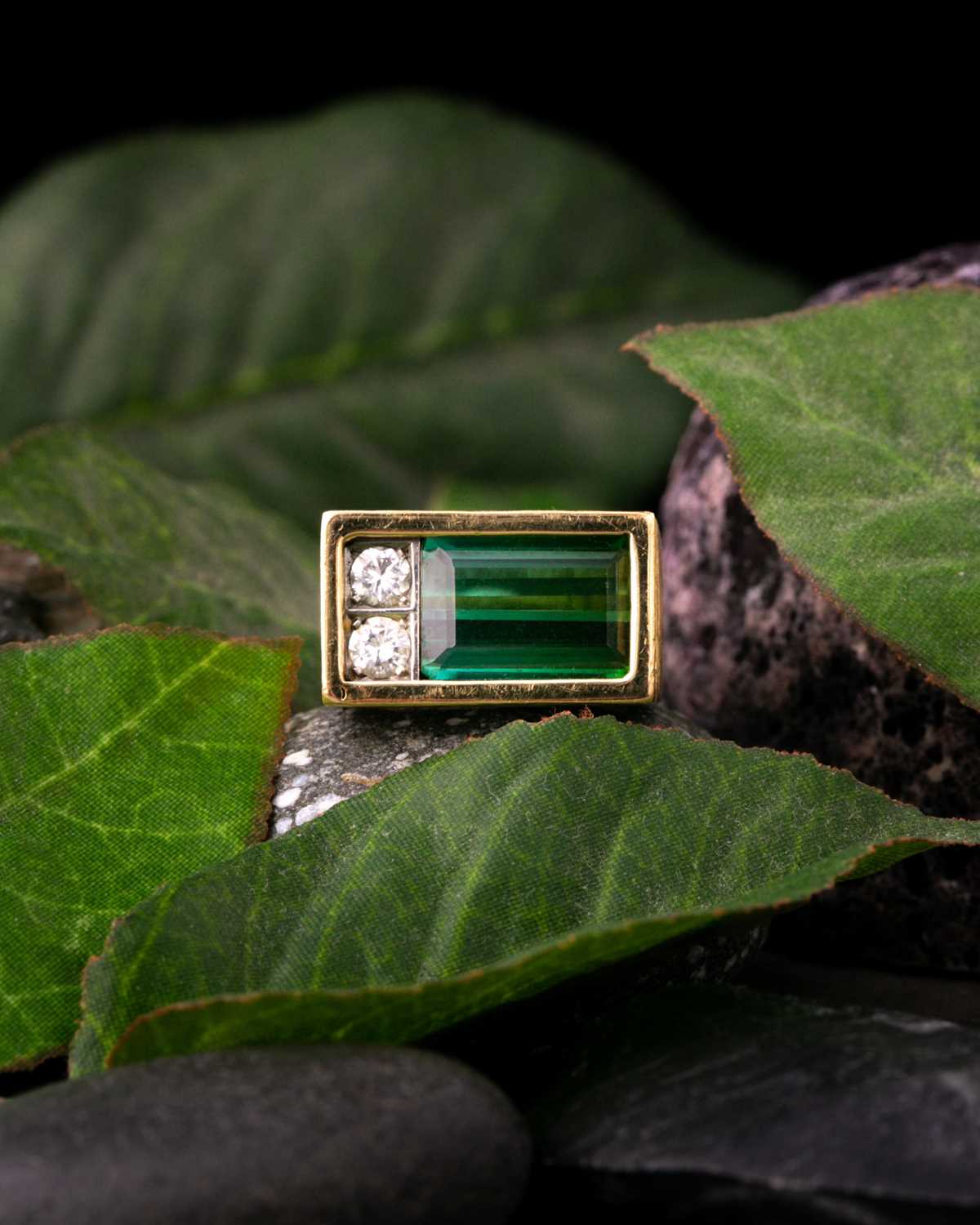 Andrew Grima. An 18ct yellow gold, tourmaline, and diamond ring, the rectangular mount set with a