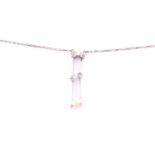 A diamond and pearl lavaliere drop pendant necklace, set with four old-cut diamonds and tow cultured