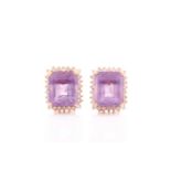 A pair of amethyst and diamond earrings, set with mixed rectangular-cut amethysts surrounded with