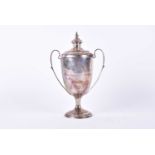 A 1920s silver two-handled trophy cup and cover. London 1927 by Charles Boyton & Co. Bearing the