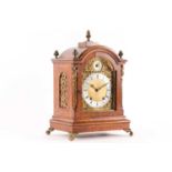 A late 19th-century Winterhalder & Hofmeier eight-day bracket clock with a brass broken arch dial