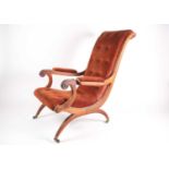 A William IV mahogany framed plantation-style open armchair with moulded and carved scroll back