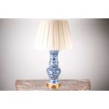 A modern Oriental blue and white porcelain baluster vase table lamp, with a turned gilt base. With