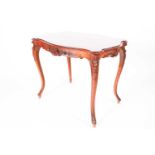 A French Louis XV Style walnut cartouch topped centre table with shell and scroll carved underframe.