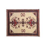 A 20th century ivory ground Afshar small rug. With geometric stylized flowers within meandering