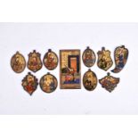 A collection of nine Persian Qajar dynasty miniature pen worked ivory and bone (camel?) panels of