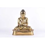 A large Chinese gilt-bronze figure of Buddha, seated in the bhumisparsa mudra with inset glass