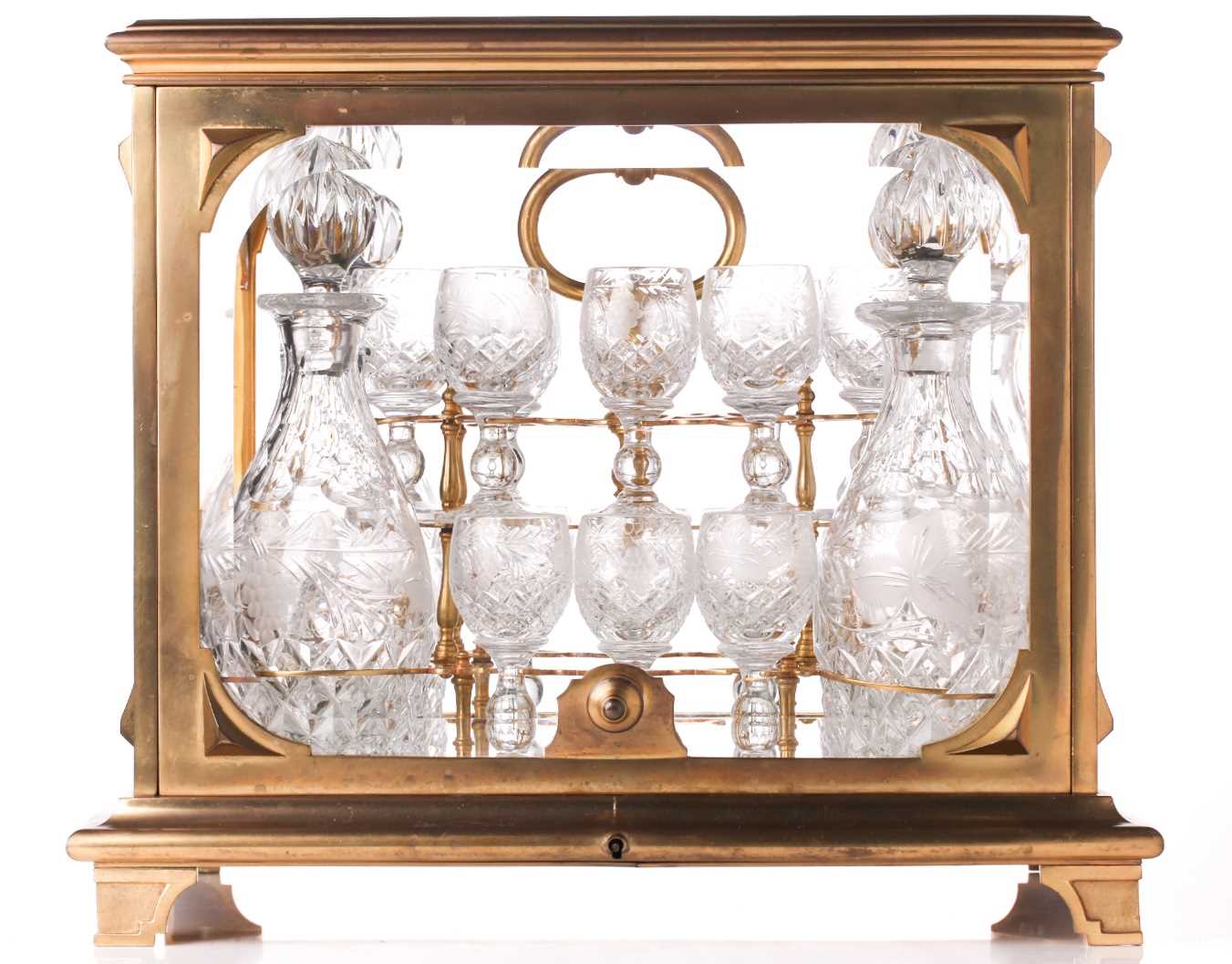 Baccarat: a French late 19th / early 20th century ormolu and crystal tantalus, with lift a folding