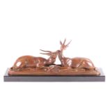 Louis-Albert Carvin (1875-1951), a patinated bronze study of a pair of recumbent antelopes, with a
