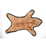 A brown bearskin floor rug, 186 cm x 105 cm