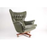 G Plan 6250 Blofeld armchair upholstered in sage green vinyl. Supported on a swivel and reclining