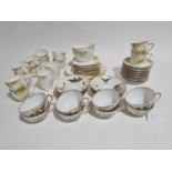 A late 19th century Pirkenhammer eight place part tea set, decorated with birds, insects and