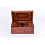 A George III flame mahogany tea caddy, early 19th century, with satinwood stringing and