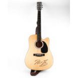 A Carlo Robelli acoustic guitar, (104 cm total length), bearing a signature in black marker,