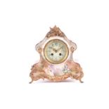 A French early 20th century 8-day porcelain cased mantle clock. The simple movement chiming the