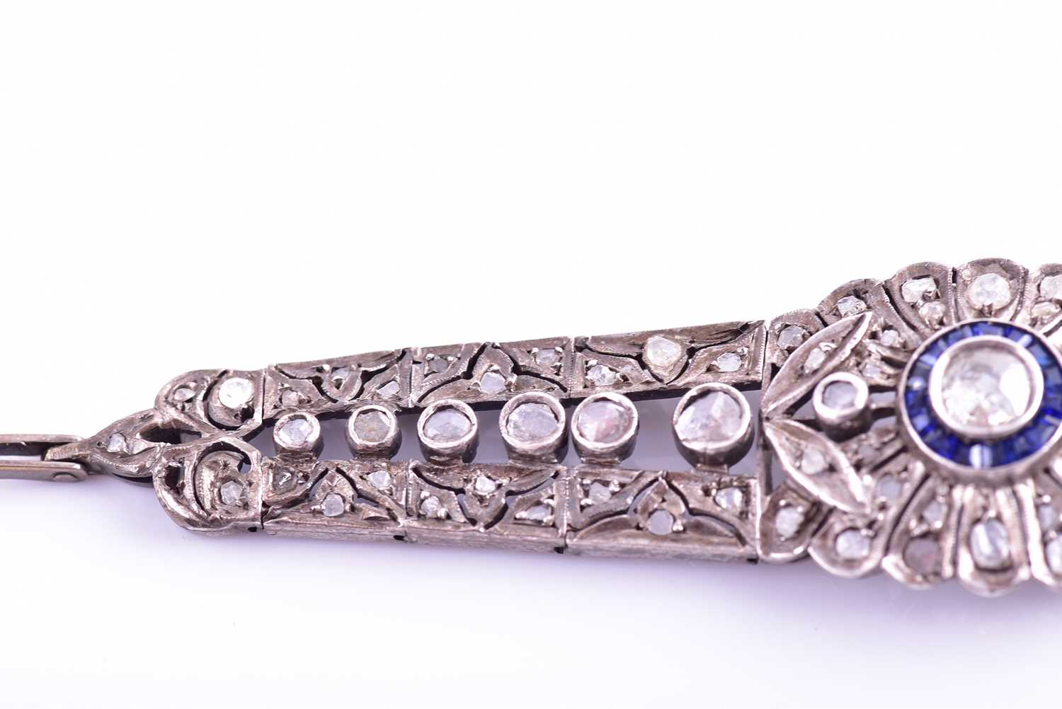 An early 20th century diamond and sapphire bracelet, the articulated mount centred with an old-cut - Image 3 of 8