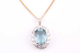 A yellow metal, diamond, and aquamarine pendant, set with a mixed oval-cut aquamarine of