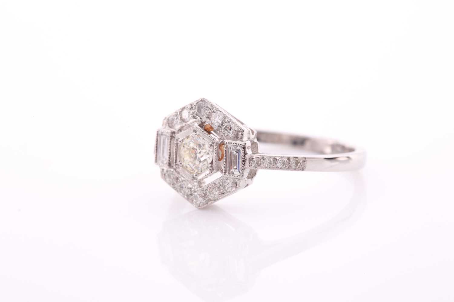 A platinum and diamond ring of hexagonal design, centred with a round brilliant-cut diamond within a - Image 2 of 4