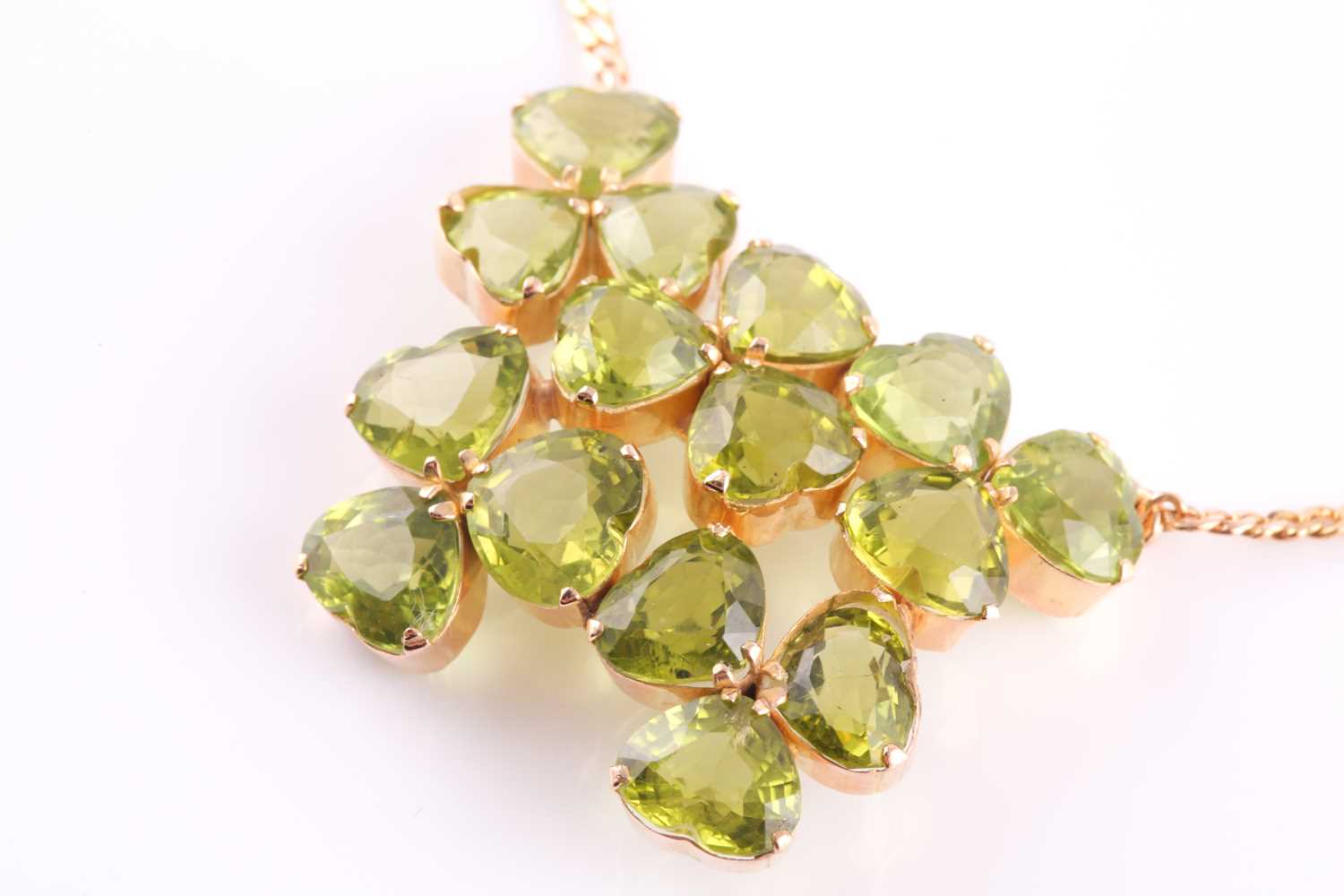 A peridot pendant; with centre composed of five three stone foliate clusters each set with the heart - Image 4 of 5