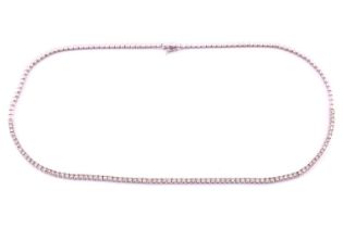 An 18ct white gold and diamond line necklace, the chain half set with round brilliant-cut