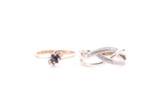 A three stone diamond ring and sapphire crossover ring; the mount marked '375'; together with a
