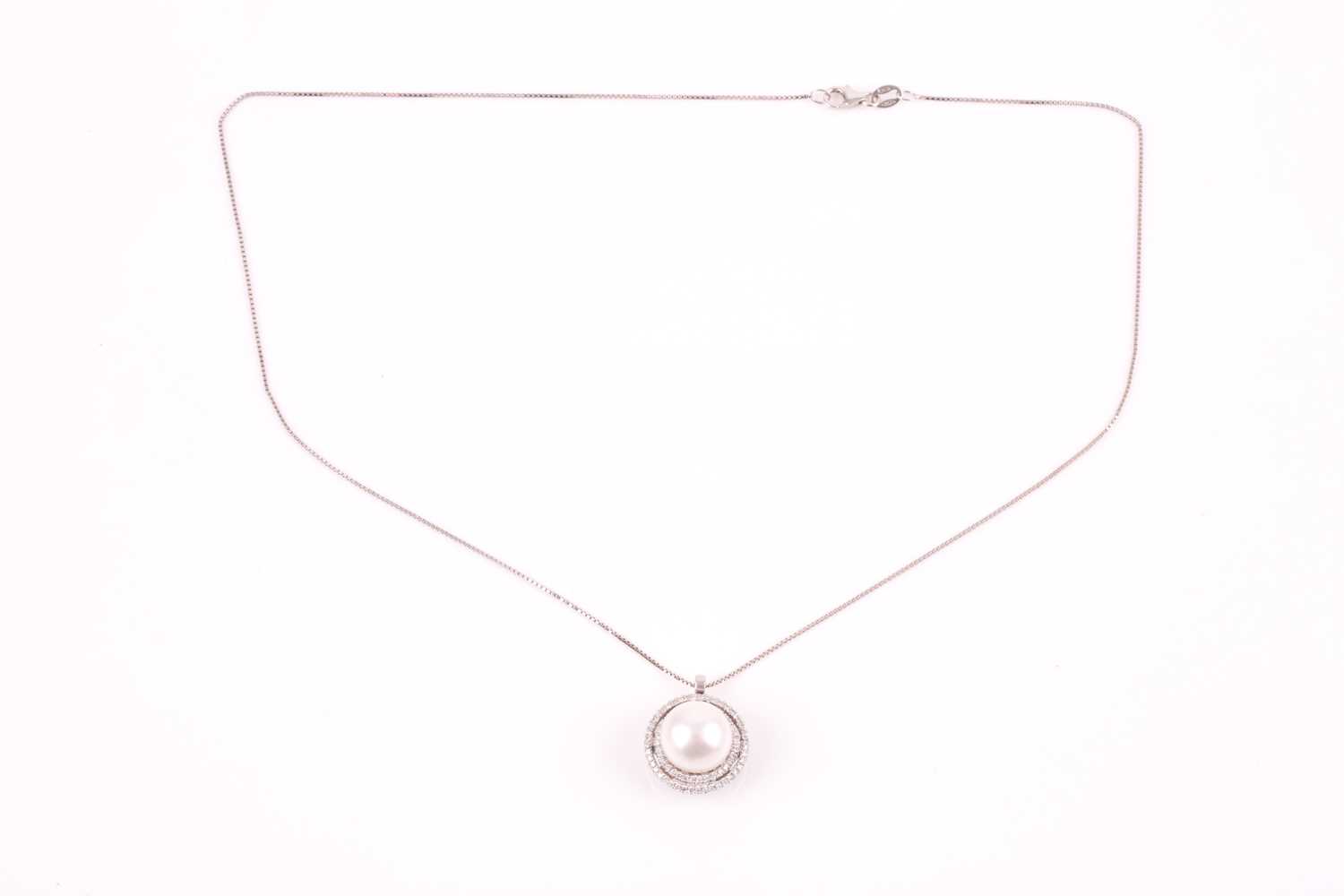 A diamond and pearl pendant, the round white pearl within a double halo border of round-cut - Image 2 of 3