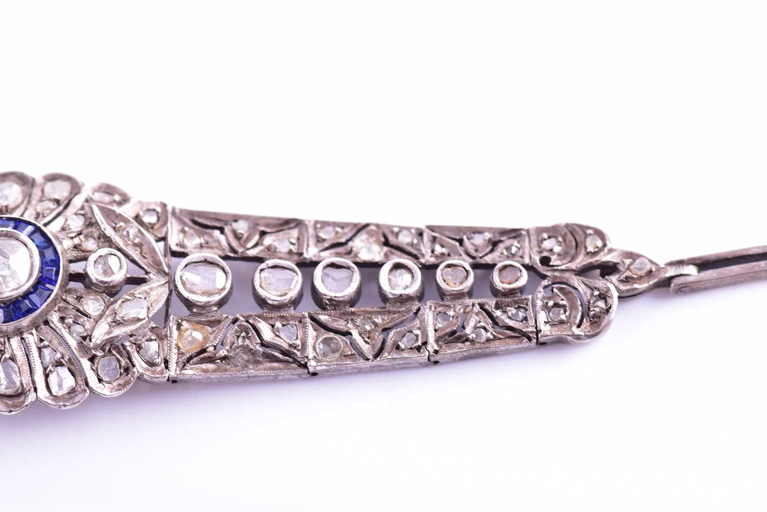 An early 20th century diamond and sapphire bracelet, the articulated mount centred with an old-cut - Image 6 of 8