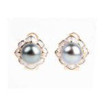 A pair of Tahitian grey pearl and baguette diamond cluster earrings, the central pearls within a