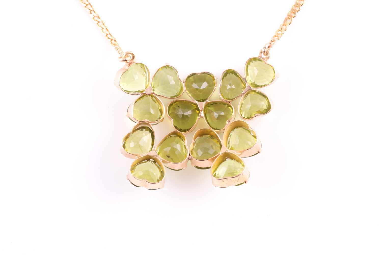 A peridot pendant; with centre composed of five three stone foliate clusters each set with the heart - Image 3 of 5