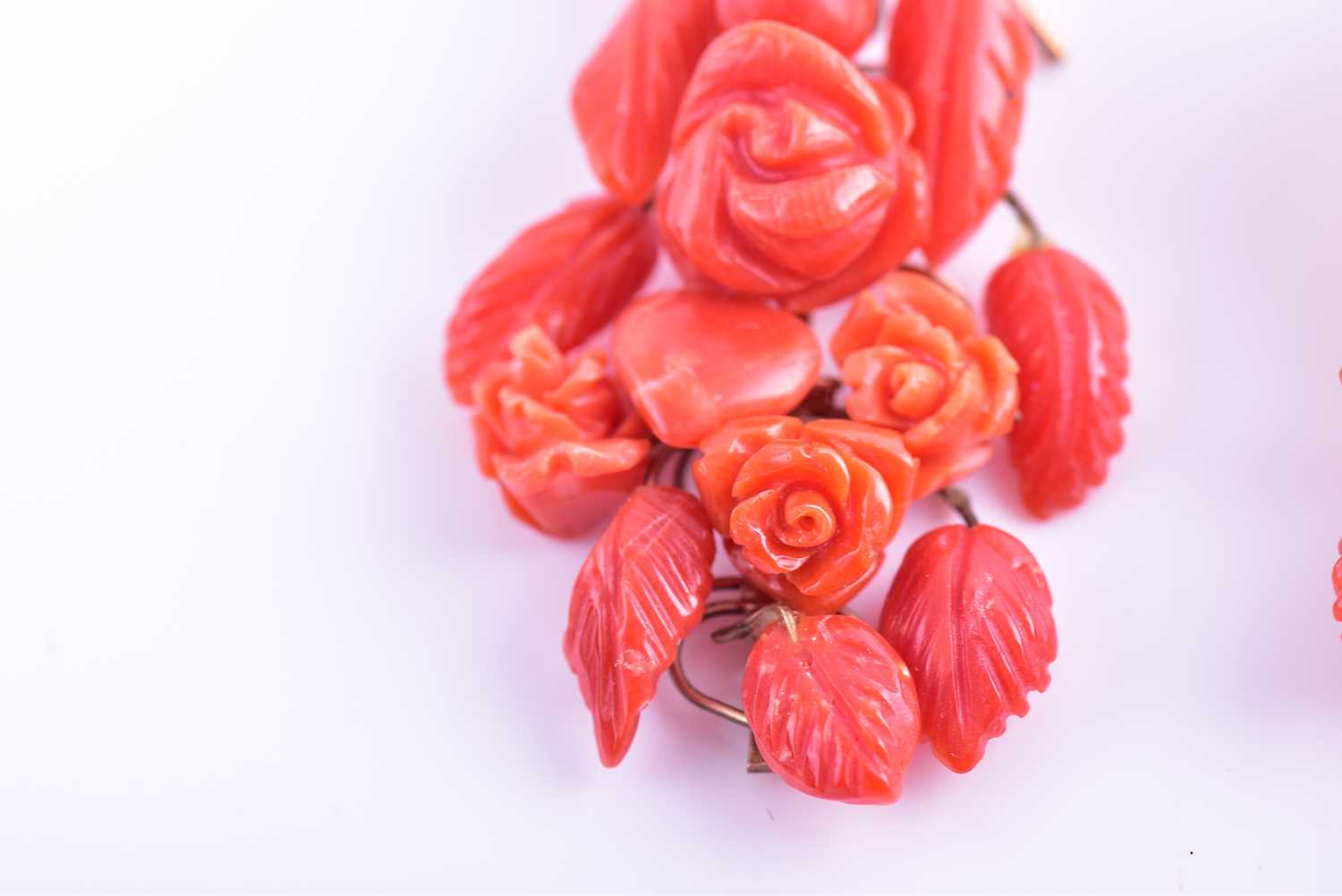 A pair of yellow metal and carved coral drop earrings, wire-set with foliate and floral carved red - Image 4 of 6